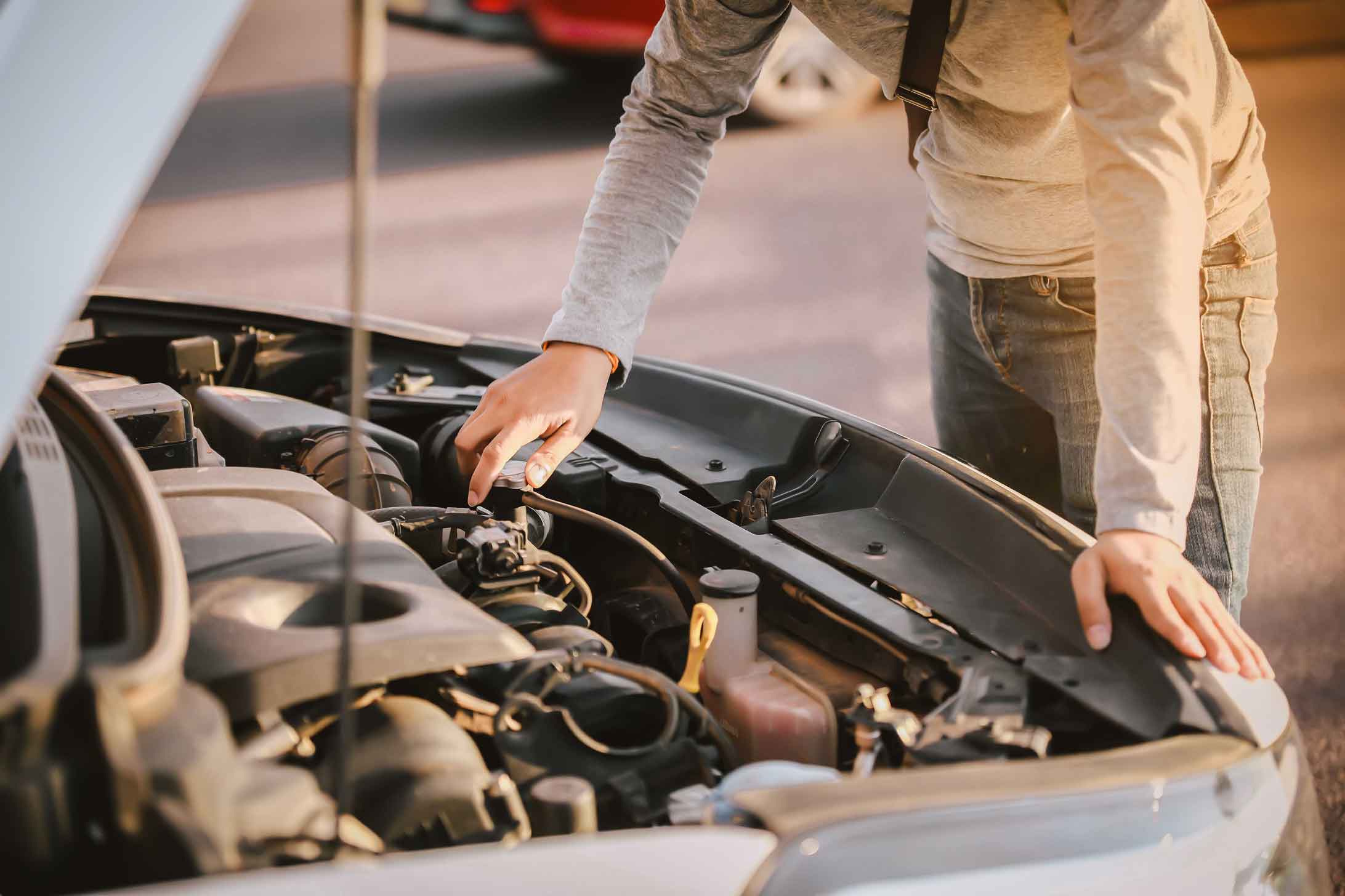 Vehicle Recall Management and Man Checking the Car Engine